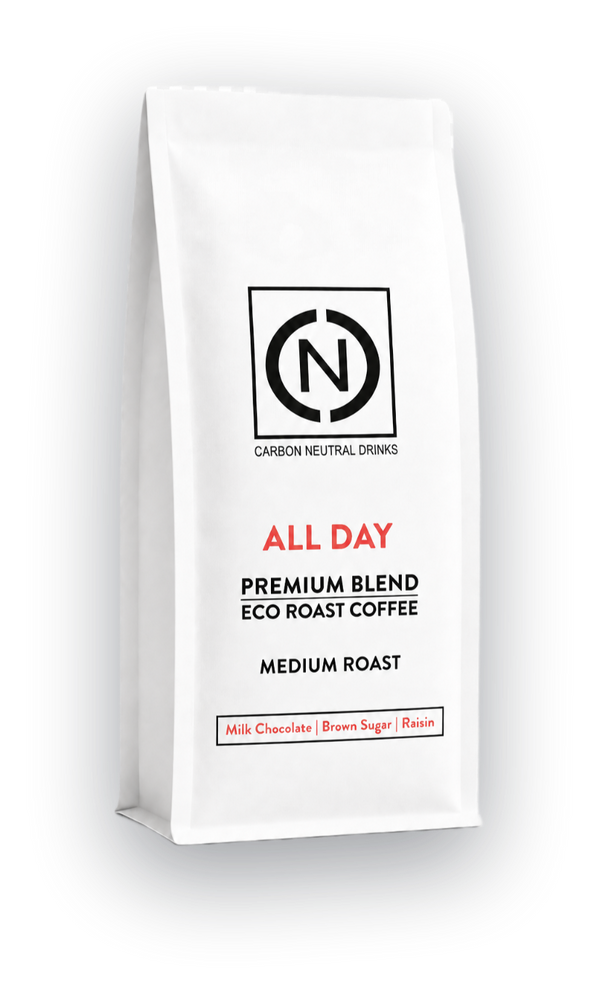 A white bag of Carbon Neutral Drinks All Day Blend Eco Roast Coffee, Medium Roast, shown on a clean white background with a soft shadow.