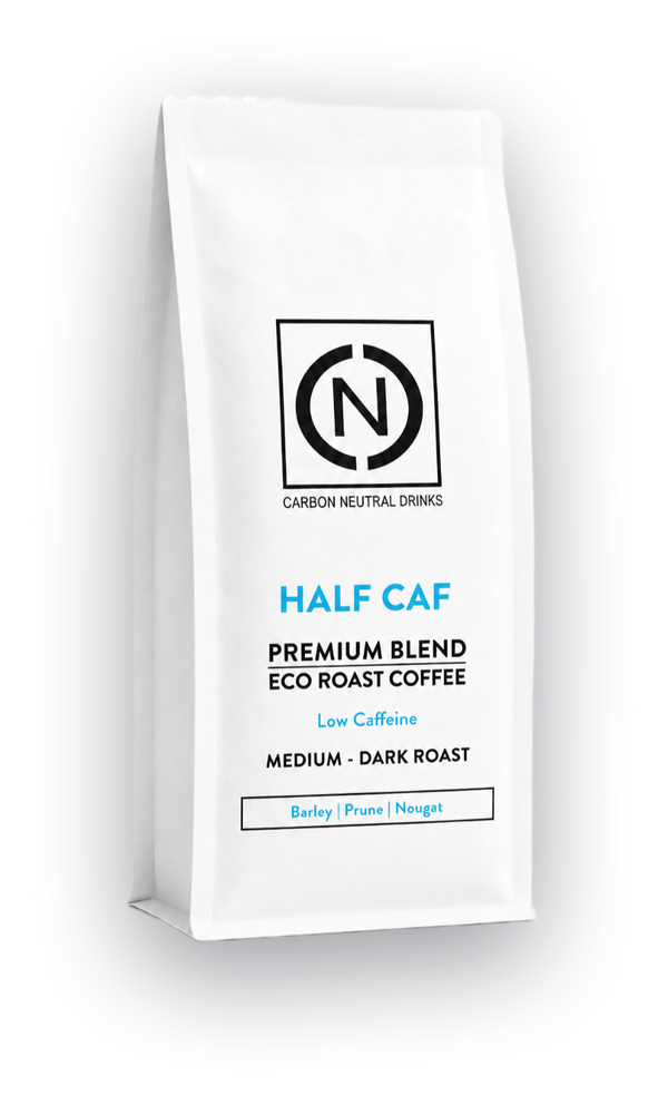 A white bag of Carbon Neutral Drinks Haf Caf Blend Eco Roast Coffee, Medium-Dark Roast, shown on a clean white background with a soft shadow.