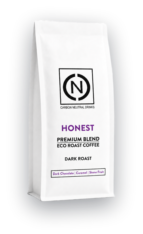 A white bag of Carbon Neutral Drinks Honest Blend Eco Roast Coffee, Dark Roast, shown on a clean white background with a soft shadow.