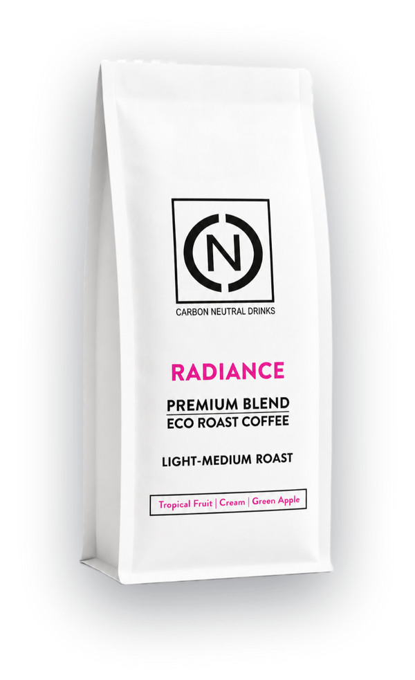 A white bag of Carbon Neutral Drinks Radiance Blend Eco Roast Coffee, Light-Medium Roast, shown on a clean white background with a soft shadow.