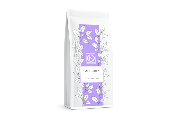 A white stand-up pouch of loose leaf Earl Grey tea with a vertical lavender purple panel and white leaf illustrations.