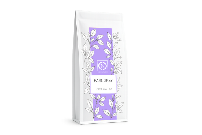 A white stand-up pouch of loose leaf Earl Grey tea with a vertical lavender purple panel and white leaf illustrations.