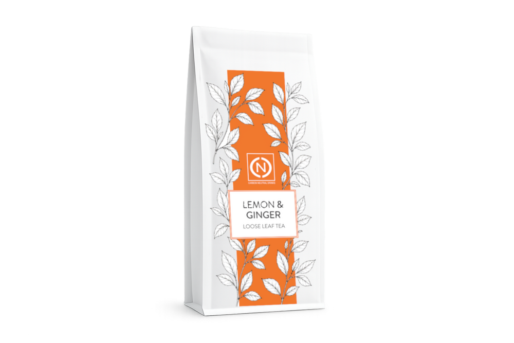 A white stand-up pouch of loose leaf tea labeled 'LEMON & GINGER' with an orange central panel. — photo 1