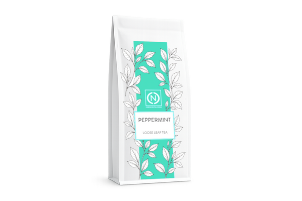 A white stand-up pouch of peppermint loose leaf tea with a prominent teal vertical label.