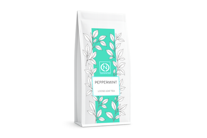 A white stand-up pouch of peppermint loose leaf tea with a prominent teal vertical label.