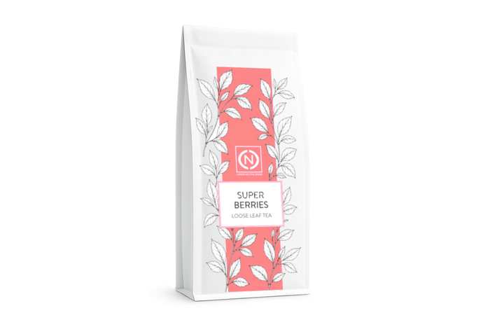 A white stand-up pouch of Super Berries Loose Leaf Tea, featuring a coral pink vertical stripe.